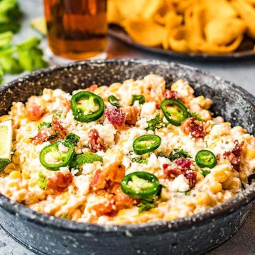 Mexican dip in a bowl with chips and salsa, perfect for your next gathering.