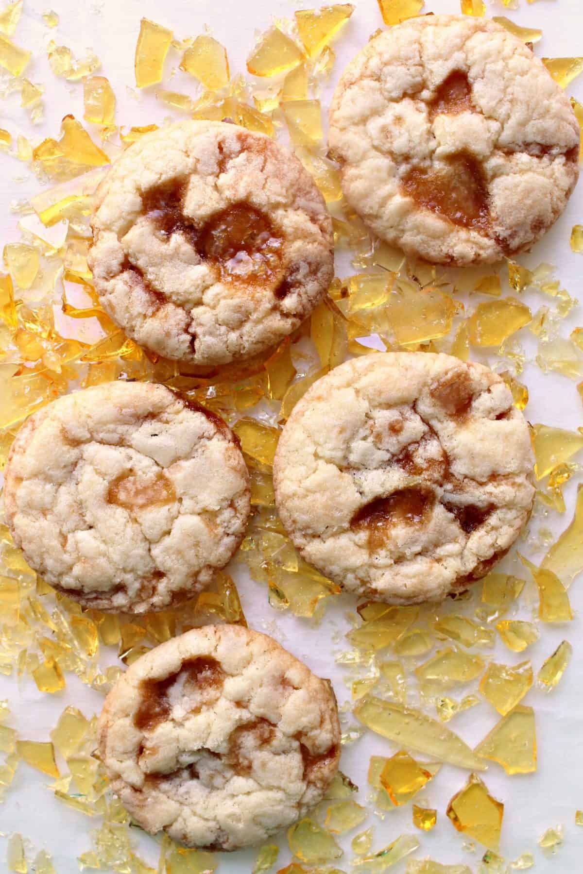 A plate of cookies with a unique yellow glaze on top.